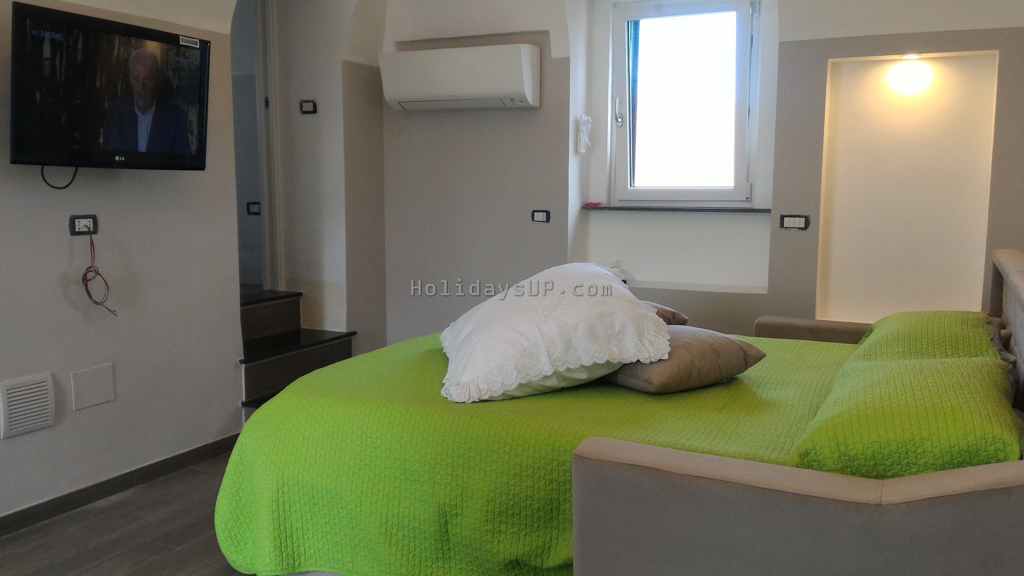 Room with double sofa bed and private bathroom