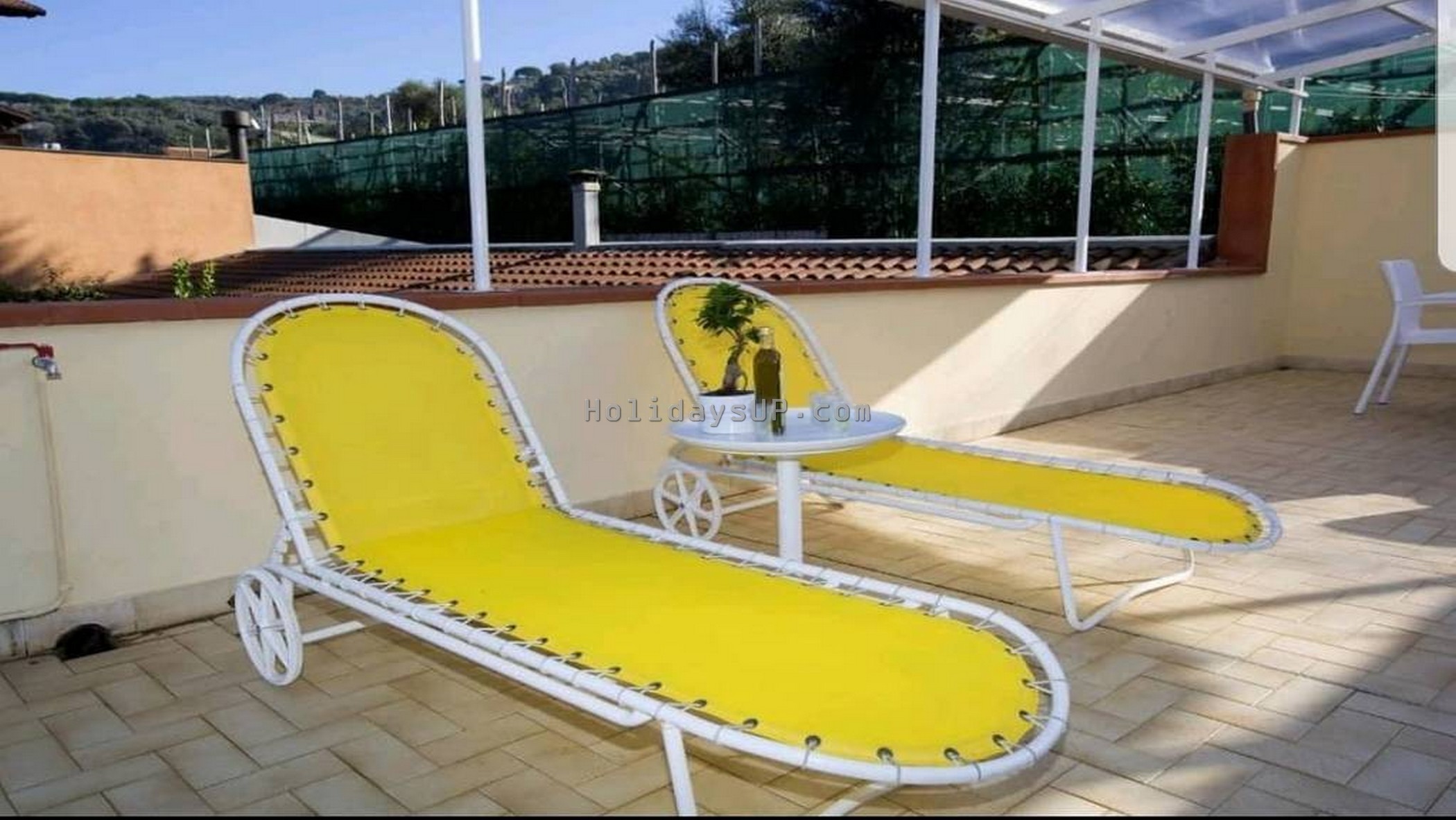 Large terrace solarium with sunbeds and shower at Casa Mariandre A